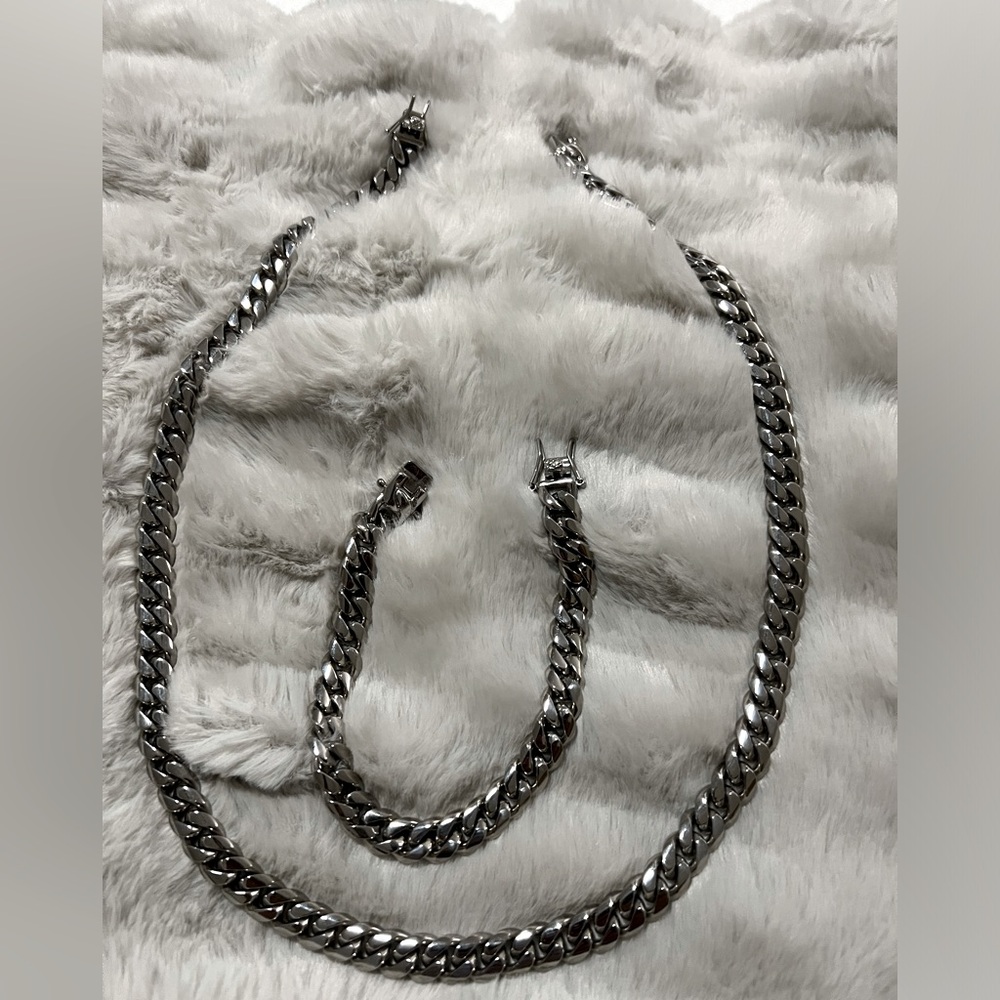 24” steel necklace and 9” bracelet worn once perfect condition.